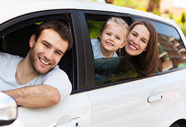 a family in their car smiling because they have Auto Insurance in Elberton, Athens, GA, Loganville, Commerce, GA, Monroe, GA, Lincolnton, GA